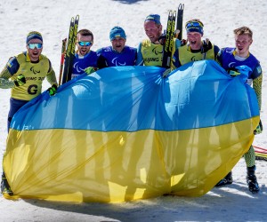 epa09809277 A handout photo made available by the Olympic Information Service shows winner Vitalii Lukianenko of Ukraine (guide Boys Babar), runner up Anatolii Kovalevskyi of Ukraine (guide Oleksandr Mukshin, and third placed Dmytro Suiarko of Ukraine (guide Oleksandr Nikonovych) celebrating after the Men's Middle Distance Vision Impaired Para Biathlon at the Zhangjiakou National Biathlon Centre during Beijing 2022 Winter Paralympic Games, Zhangjiakou, China, 08 March 2022.  EPA/Thomas Lovelock / HANDOUT  HANDOUT EDITORIAL USE ONLY/NO SALES