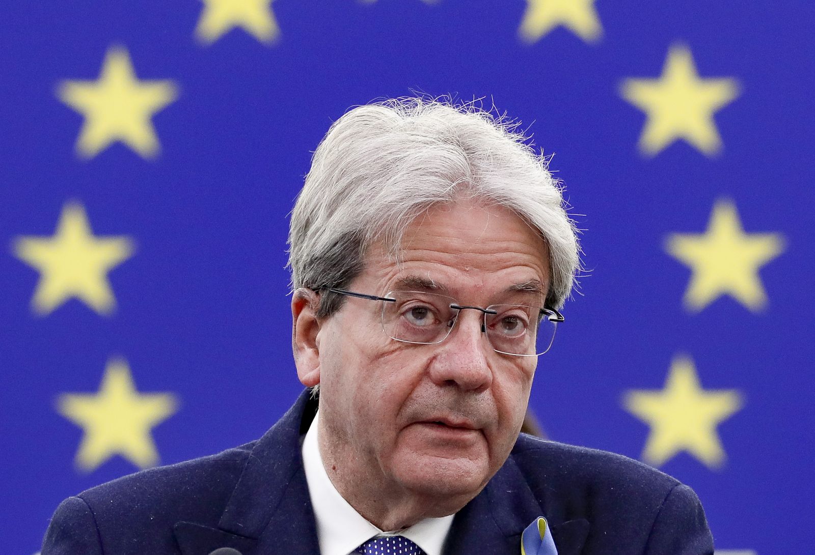 epa09812080 European Commissioner for Economy Paolo Gentiloni gives a statement on 'The European Semester for economic policy coordination: annual sustainable growth survey 2022', at the European Parliament in Strasbourg, France, 09 March 2022. The session of the European Parliament runs from 07 till 10 March 2022.  EPA/JULIEN WARNAND