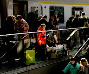 epa09812652 Arriving passengers from a train carrying Ukrainian refugees from Poland at Berlin central station Hauptbahnhof in Berlin, Germany, 09 March 2022.  According to the UNHCR, Russia's military invasion of Ukraine, which started on 24 February, has caused destruction of civilian infrastructure as well as civilian casualties, with tens of thousands internally displaced and over two million refugees fleeing Ukraine.  EPA/FILIP SINGER