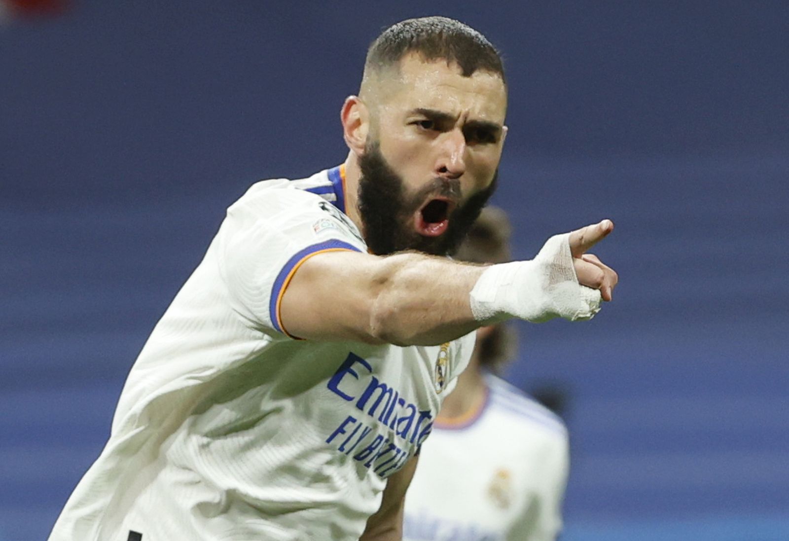 epa09813670 Real Madrid's Karim Benzema celebrates after scoring the 1-1 equalizer during the UEFA Champions League round of 16, second leg soccer match between Real Madrid and Paris Saint-Germain (PSG) in Madrid, Spain, 09 March 2022.  EPA/Juanjo Martin