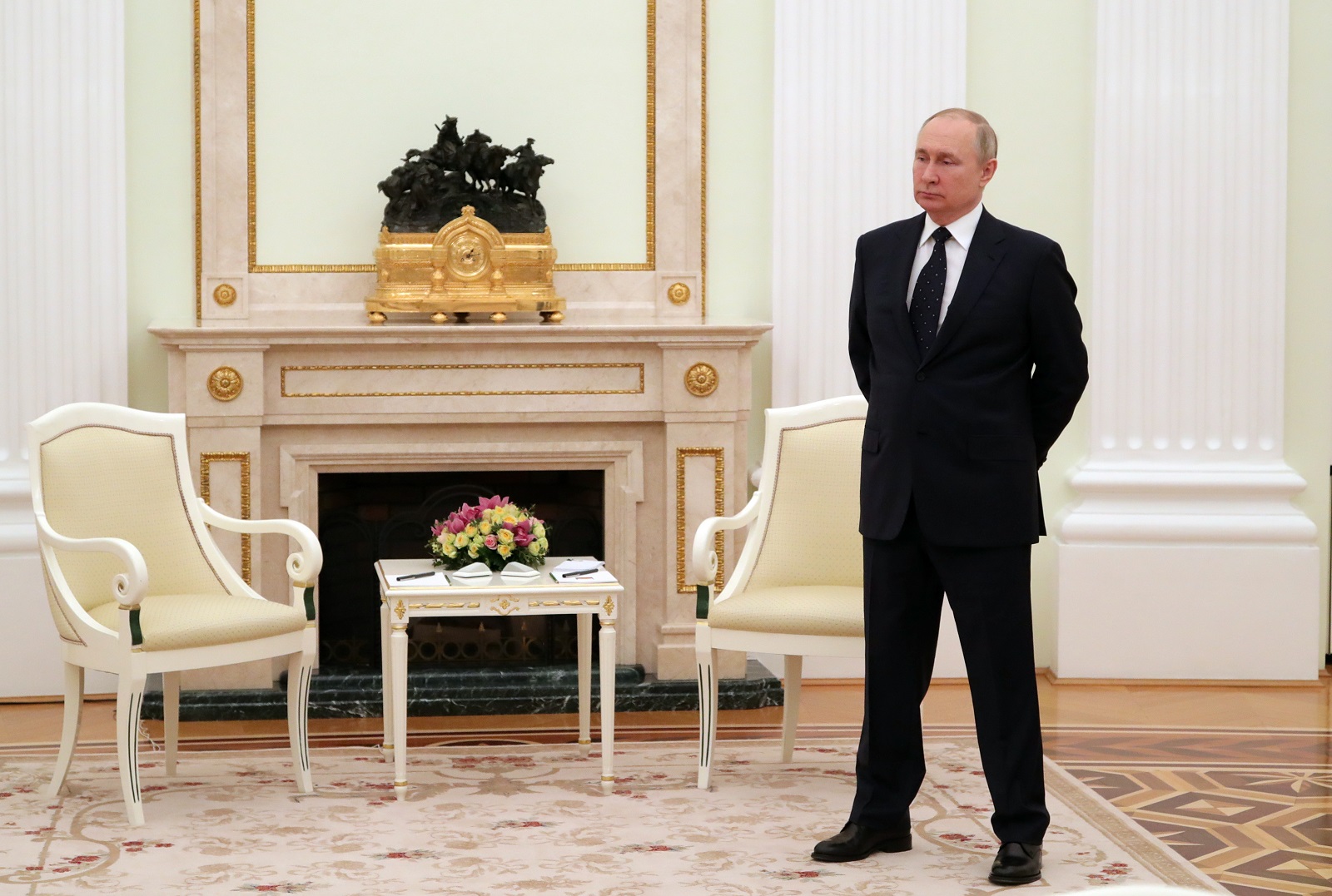 epa09816804 Russian President Vladimir Putin stands prior to a meeting with Belarusian President Alexander Lukashenko (not pictured) in the Kremlin in Moscow, Russia, 11 March 2022.  EPA/MIKHAIL KLIMENTYEV / KREMLIN POOL / SPUTNIK MANDATORY CREDIT