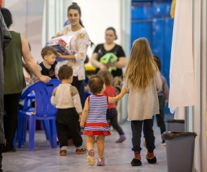 epa09818145 Children evacuated from Ukraine play at the refugee trial camp at MoldExpo national exhibition center in Chisinau, Moldova, 11 March 2022. According to UNHCR figures, more than two million Ukrainians have fled their country since Russia began its military operation in Ukraine on 24 February.  EPA/DUMITRU DORU