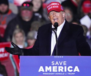 epa09820261 Former US President Donald Trump addresses an outdoor Save America rally at the Florence Regional Airport in Florence, South Carolina, USA, 12 March 2022. The rally was held in 36-degree Fahrenheit (2 degress Celsius) weather as temperatures plummeted from the Arctic Blast sweeping across the East Coast.  EPA/RICHARD ELLIS