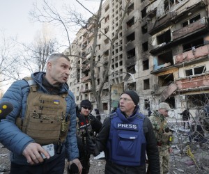 epa09824614 Kyiv's mayor Vitaliy Klitschko speaks with media near the shelled residential building in Kyiv (Kiev), Ukraine, 14 March 2022. Two persons died and three were injured during that shelling. Russian troops entered Ukraine on 24 February prompting the country's president to declare martial law and triggering a series of announcements by Western countries to impose severe economic sanctions on Russia.  EPA/SERGEY DOLZHENKO