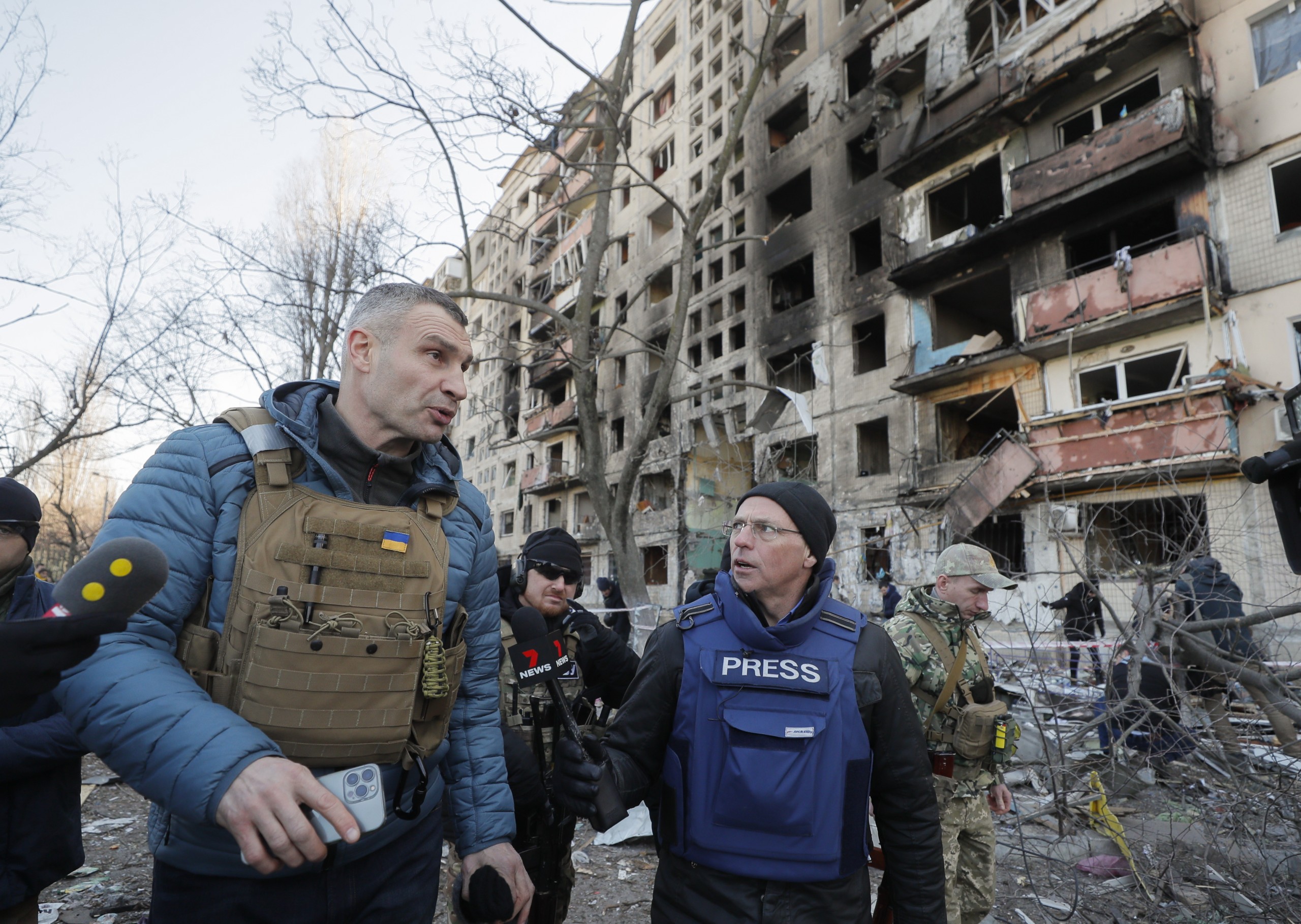 epa09824614 Kyiv's mayor Vitaliy Klitschko speaks with media near the shelled residential building in Kyiv (Kiev), Ukraine, 14 March 2022. Two persons died and three were injured during that shelling. Russian troops entered Ukraine on 24 February prompting the country's president to declare martial law and triggering a series of announcements by Western countries to impose severe economic sanctions on Russia.  EPA/SERGEY DOLZHENKO
