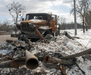 epa09829024 Debris of damaged Russian military car is seen in Kharkiv, Ukraine, 16 March 2022. The city of Kharkiv, Ukraine's second largest, has witnessed repeated air strikes from Russian forces. Russian troops entered Ukraine on 24 February prompting the country's president to declare martial law and triggering a series of announcements by Western countries to impose severe economic sanctions on Russia.  EPA/VASILIY ZHLOBSKY