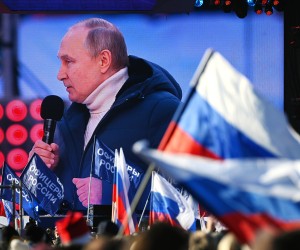 epa09833705 A screen shows Russian President Vladimir Putin delivering a speech during a concert marking the 8th anniversary of Crimea's reunification with Russia at the Luzhniki stadium in Moscow, Russia, 18 March 2022. Russia in 2014 annexed the Black Sea peninsula, shortly after Crimeans voted in a disputed referendum to secede from Ukraine.  EPA/VLADIMIR ASTAPKOVICH / SPUTNIK / POOL MANDATORY CREDIT