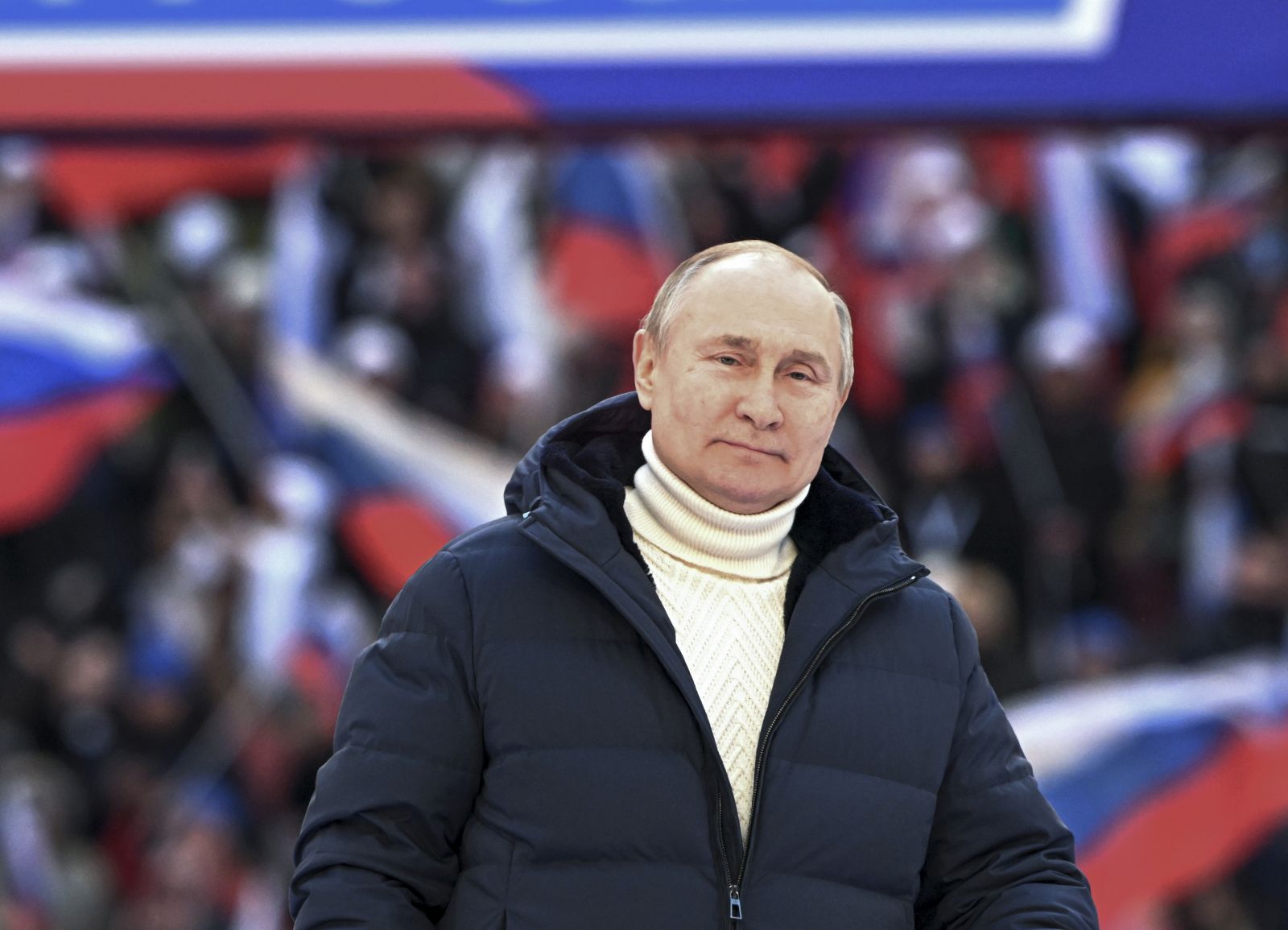 epa09834243 Russian President Vladimir Putin delivers a speech during a concert marking the 8th anniversary of Crimea's reunification with Russia at the Luzhniki stadium in Moscow, Russia, 18 March 2022. The banner holds letter Z and says 'For Russia'. The letter Z, painted on Russian military vehicles in Ukraine, has quickly become a symbol of support a 'special military operation' carried out by the Russian Armed Forces in Ukraine. Russia in 2014 annexed the Black Sea peninsula, shortly after Crimeans voted in a disputed referendum to secede from Ukraine.  EPA/RAMIL SITDIKOV / SPUTNIK POOL