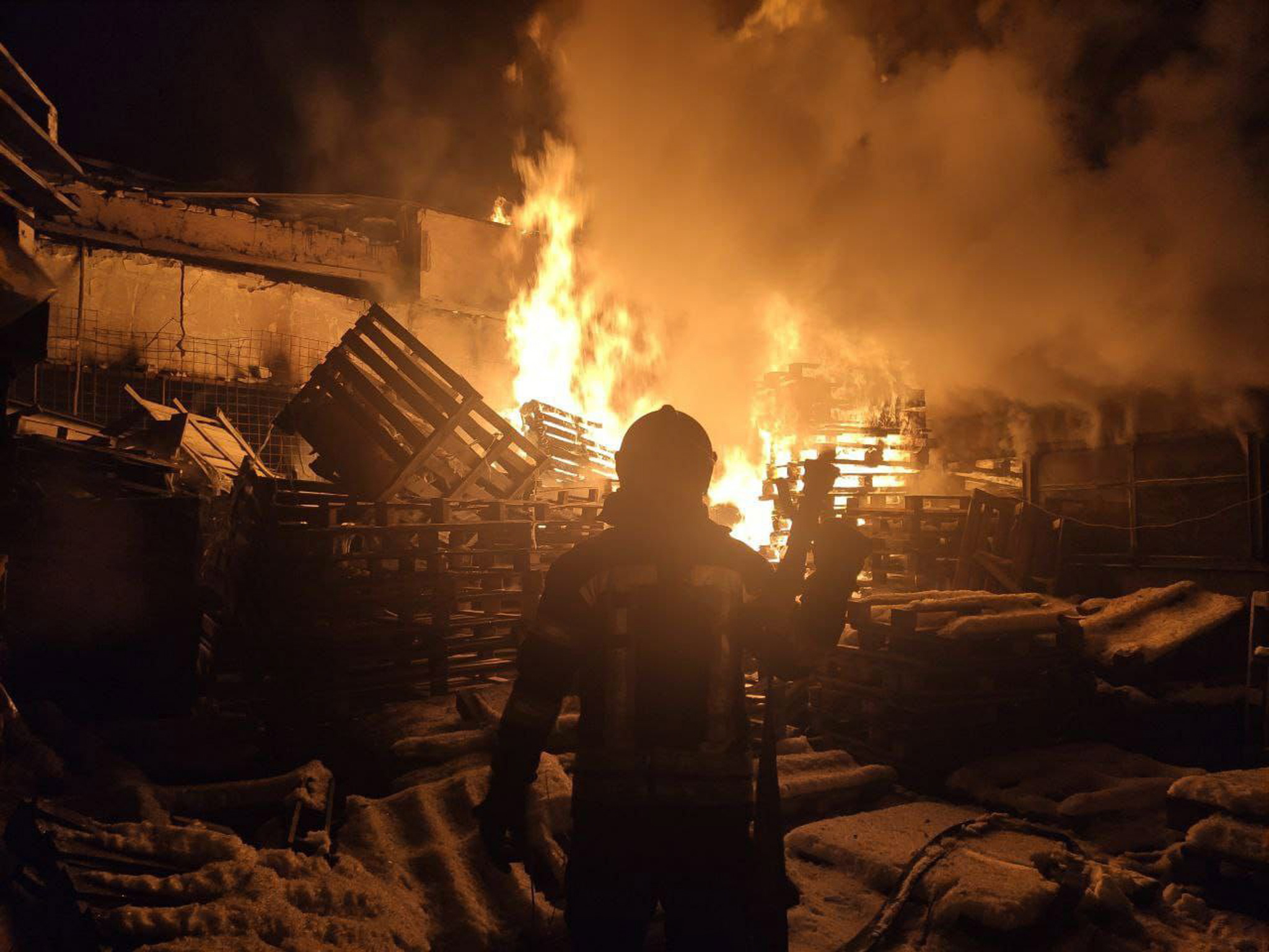 epa09840303 A handout photo released by the press service of the State Emergency Service of Ukraine on 21 March 2022 shows firefighters responding to a large-scale fire at a warehouse following shelling in Severodonetsk, Luhansk region, Ukraine. According to the Luhansk Regional State Administration, State Emergency Service of Ukraine personnel in the Luhansk region were involved in extinguishing 10 fires on 20 March, caused by shelling by the occupying Russian troops.  EPA/STATE EMERGENCY SERVICE OF UKRAI -- BEST QUALITY AVAILABLE -- MANDATORY CREDIT: STATE EMERGENCY SERVICE OF UKRAINE -- HANDOUT EDITORIAL USE ONLY/NO SALES