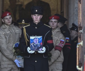 epa09844953 Russian sailors carry a coffin and a photograph of the Deputy Commander of the Black Sea Fleet for Military-Political Work (VPR), Captain 1st Rank Andrei Paly, who was killed in the recent battles of Mariupol, during a farewell ceremony in Sevastopol, Crimea, 23 March 2022. On 24 February Russian troops had entered Ukrainian territory in what the Russian president declared a 'special military operation', resulting in fighting and destruction in the country, a huge flow of refugees, and multiple sanctions against Russia.  EPA/STRINGER