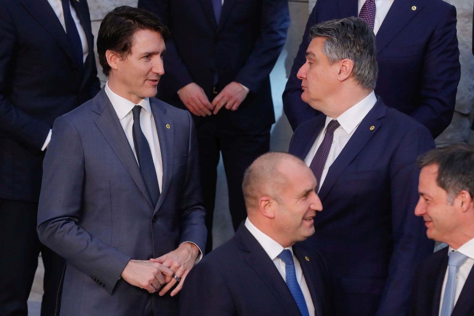 epa09845883 Canadian Prime Minister Justin Trudeau (L) and Croatian President Zoran Milanovic talk during a family picture for an extraordinary NATO Summit at the Alliance headquarters in Brussels, Belgium, 24 March 2022. NATO leaders will address the consequences of Russian President Putin's invasion of Ukraine, discuss the role of China in this crisis, and decide on the next steps to strengthen NATO's deterrence and defence.  EPA/STEPHANIE LECOCQ