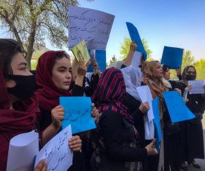 epa09850648 Afghan teachers hold placads during a protest near the main entrance of the ministry of education for raising their voices for their education rights and reopening the secondary and high schools for girls in Kabul, Afghanistan, 26 March 2022. The Taliban on 23 March barred girls of grades seven to 12 from attending schools pending a decision on their uniform designs according to Islamic law, in a sudden departure from their earlier announcement that all Afghan females would be allowed to attend classes this week. Allowing girls of all ages to attend schools has been one of the most crucial demands set by the international community after the Taliban, came to power.  EPA/STRINGER