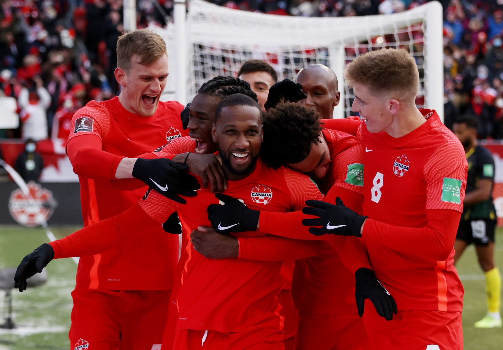 Soccer Football - World Cup - CONCACAF Qualifiers - Canada v Jamaica - BMO Field, Toronto, Canada - March 27, 2022 Canada's Junior Hoilett celebrates scoring their third goal with teammates REUTERS/Carlos Osorio