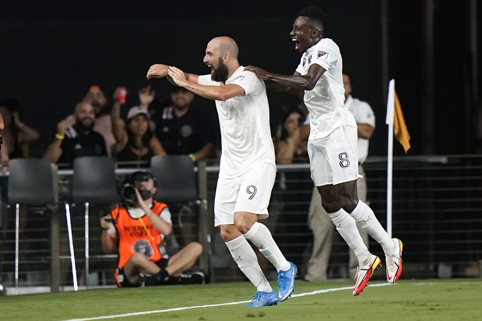 Inter Miami forward Gonzalo Higuain (9) celebrates with midfielder Blaise Matuidi (8) after scoring during the first half of an MLS soccer match against Columbus Crew, Saturday, Sept. 11, 2021, in Fort Lauderdale, Fla. (AP Photo/Lynne Sladky)