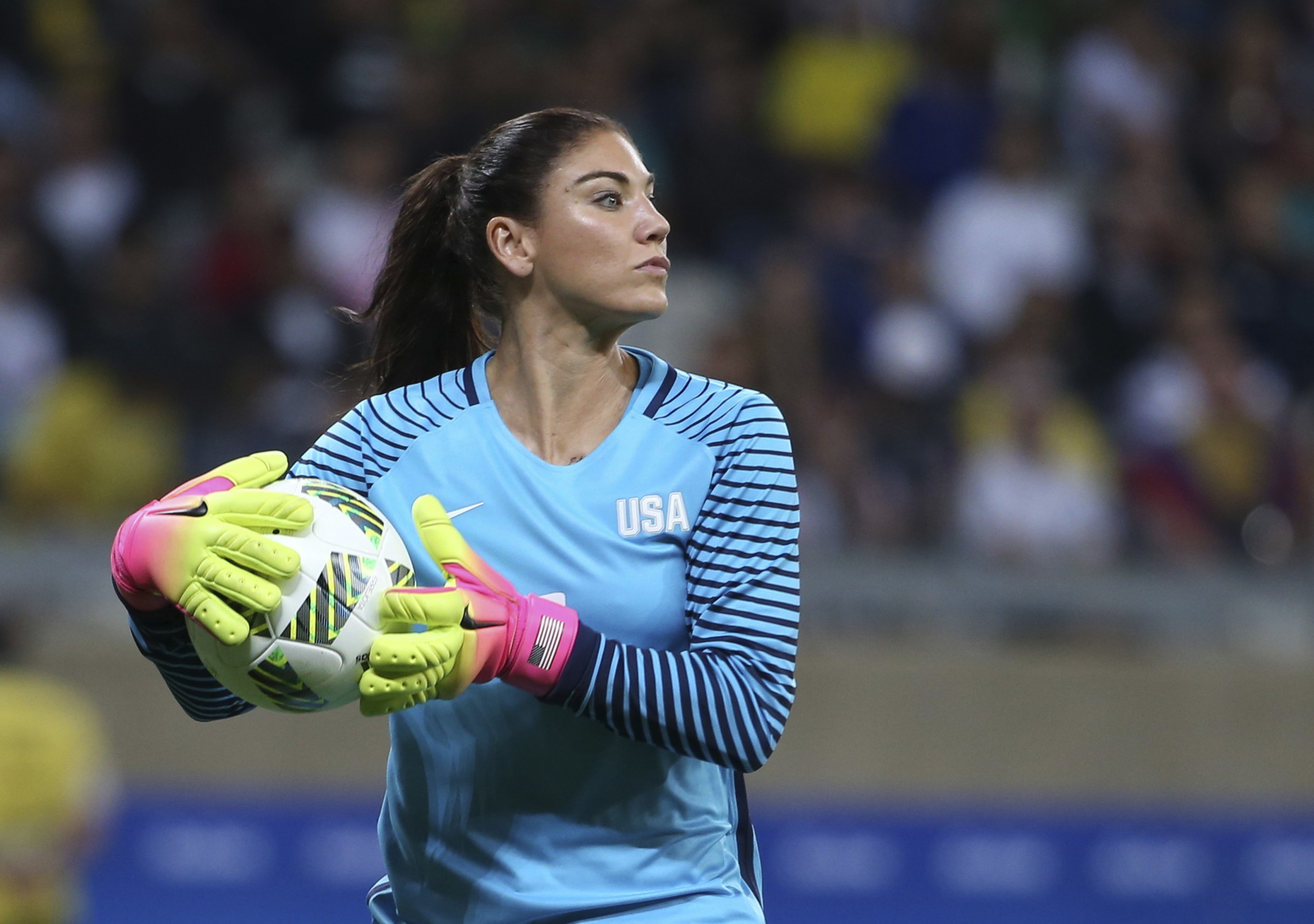 FILE - United States' goalkeeper Hope Solo takes the ball during a women's soccer game at the Rio Olympics against New Zealand in Belo Horizonte, Brazil, Aug. 3, 2016. Former U.S. women’s national team star goalkeeper Solo was arrested after police say she was found passed out behind the wheel of a vehicle in North Carolina with her two children inside. A police report said Solo was arrested on Thursday, March 31, 2022, in a shopping center parking lot in Winston-Salem and charged with driving while impaired, resisting a public officer and misdemeanor child abuse. (AP Photo/Eugenio Savio, File)