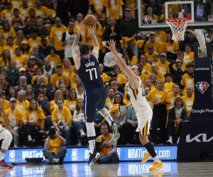 Dallas Mavericks guard Luka Doncic (77) shoots as Utah Jazz forward Bojan Bogdanovic, right, defends in the second half of Game 4 of an NBA basketball first-round playoff series, Saturday, April 23, 2022, in Salt Lake City. (AP Photo/Rick Bowmer)