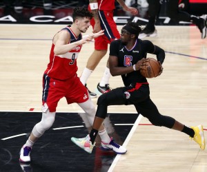 epa09814036 Los Angeles Clippers guard Reggie Jackson (R) in action against Washington Wizards forward Deni Avdija (L) during the second quarter of the NBA basketball game between the Los Angeles Clippers and the Washington Wizards at the Crypto.com Arena in Los Angeles, California, USA, 09 March 2022.  EPA/ETIENNE LAURENT SHUTTERSTOCK OUT