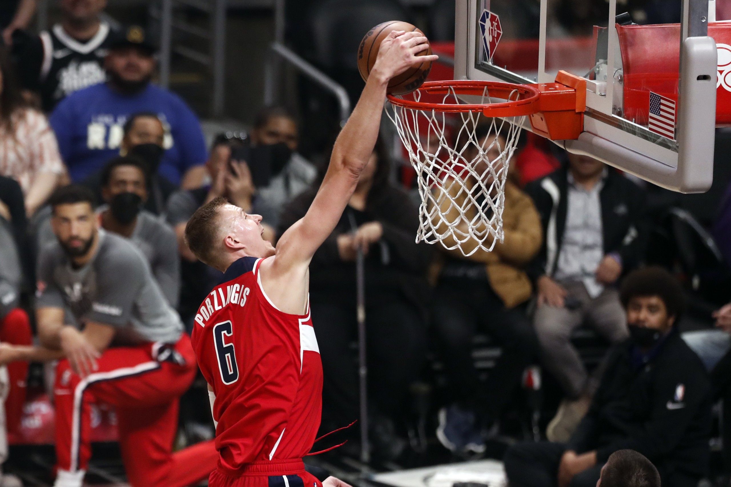 epa09814005 Washington Wizards forward-center Kristaps Porzingis scores during the first quarter of the NBA basketball game between the Los Angeles Clippers and the Washington Wizards at the Crypto.com Arena in Los Angeles, California, USA, 09 March 2022.  EPA/ETIENNE LAURENT SHUTTERSTOCK OUT