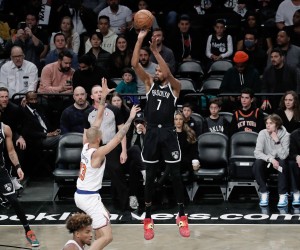 epa09822673 Brooklyn Nets forward Kevin Durant shoots (C) shoots over New York Knicks guard Evan Fournier during the first half of the NBA basketball game between the Brooklyn Nets and the New York Knicks  at Barclays Center in  Brooklyn, New York, USA, 13 March  2022.  EPA/Peter Foley SHUTTERSTOCK OUT