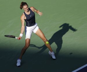 epa09830056 Petra Martic of Croatia in action against Simona Halep of Romania at the BNP Paribas Open tennis tournament at the Indian Wells Tennis Garden in Indian Wells, California, USA, 16 March 2022.  EPA/JOHN G MABANGLO