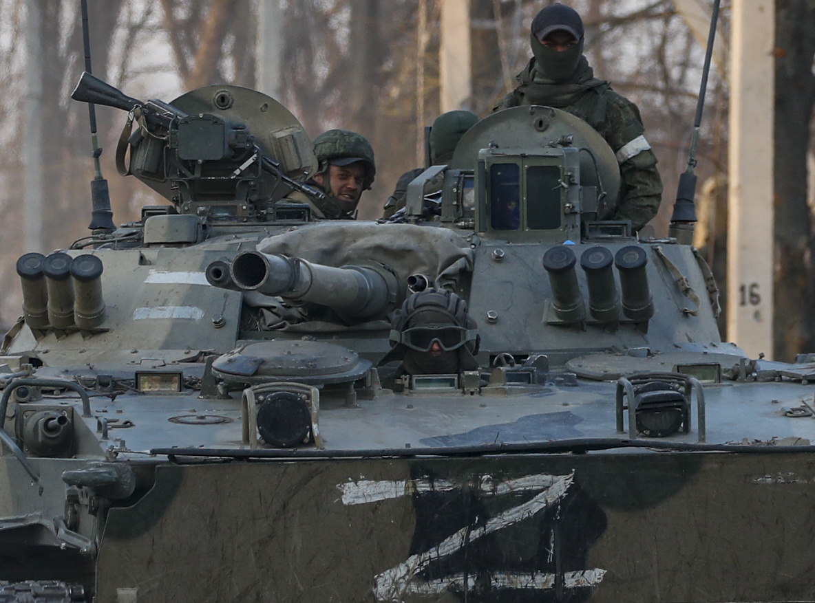 epa09851810 Russian servicemen drive on the infantry armoured vehicle in downtown of Volnovakha, Ukraine, 26 March 2022. Troops of the self-proclaimed Donetsk People's Republic with Russian support entered Volnovakha, a small town near Donetsk. Donetsk People's Republic official said that the housing stock of the city of Volnovakha was destroyed by 85 percent, the city would have to be rebuilt. On 24 February Russian troops had entered Ukrainian territory in what the Russian president declared a 'special military operation', resulting in fighting and destruction in the country, a huge flow of refugees, and multiple sanctions against Russia.  EPA/SERGEI ILNITSKY