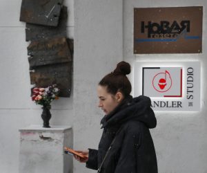 epa09856004 A woman walks pass a building housing the head office of the Novaya Gazeta newspaper in Moscow, Russia, 28 March 2022. Novaya Gazeta announced on 28 March 2022 that after two written warning received from the Russian federal agency Roskomnadzor responsible for supervision of communications, information technology and mass media, the Novaya Gazeta is suspending its publications online and on paper until the end of 'the special operation in Ukraine'. On 24 February Russian troops had entered Ukrainian territory in what the Russian president declared a 'special military operation', resulting in fighting and destruction in the country, a huge flow of refugees, and multiple sanctions against Russia.  EPA/YURI KOCHETKOV