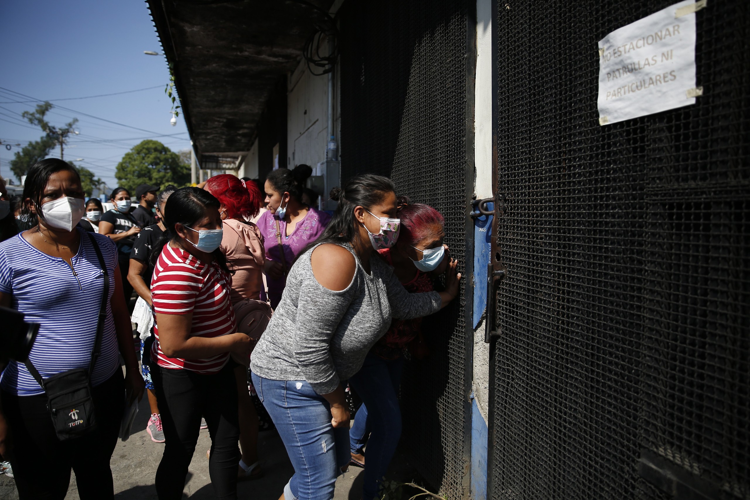 epa09862788 Women gather to receive information about relatives detained during the State of Exception, in San Salvador, El Salvador, 31 March 2022. The entry into force of a package of penal reforms, approved on 30 March by Congress and that include the prison for minors, mark the route that the Government decided to take against the gangs after a murder crisis that claimed the life of more than 80 people on the weekend. El Salvador has been under an emergency state since 27 March and the fifth day of suspension of constitutional guarantees is marked by these measures and the transfers to prisons of the detainees, which total about 3,000.  EPA/Rodrigo Sura
