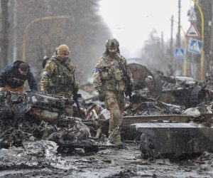 epa09868083 Ukrainian Soldiers inspect destroyed Russian military machinery in the areas recaptured by the Ukrainian army in the city of Bucha, Ukraine, 03 April 2022. Dmitrivka and the area around had recently been recaptured by the Ukrainian army from Russian forces. On 24 February, Russian troops had entered Ukrainian territory in what the Russian president declared a 'special military operation', resulting in fighting and destruction in the country, a huge flow of refugees, and multiple sanctions against Russia  EPA/ATEF SAFADI