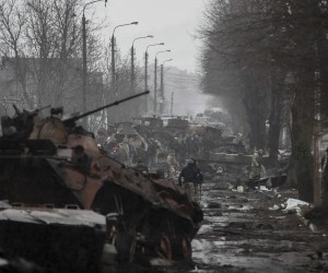 epa09868169 Ukrainian soldiers inspect destroyed Russian military machinery in the areas recaptured by the Ukrainian army in the city of Bucha, Ukraine, 03 April 2022. Dmitrivka and the area around had recently been recaptured by the Ukrainian army from Russian forces. On 24 February, Russian troops had entered Ukrainian territory in what the Russian president declared a 'special military operation', resulting in fighting and destruction in the country, a huge flow of refugees, and multiple sanctions against Russia.  EPA/ATEF SAFADI