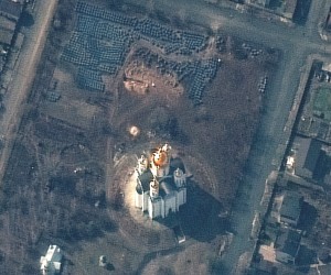 epa09869750 A handout satellite image made available by Maxar Technologies shows a probable grave site (C, top) near the Church of Saint Andrew and Pyervozvannoho All Saints in Bucha, Ukraine, 31 March 2022 (issued 04 April 2022).  EPA/MAXAR TECHNOLOGIES HANDOUT -- MANDATORY CREDIT: SATELLITE IMAGE 2022 MAXAR TECHNOLOGIES -- THE WATERMARK MAY NOT BE REMOVED/CROPPED -- HANDOUT EDITORIAL USE ONLY/NO SALES