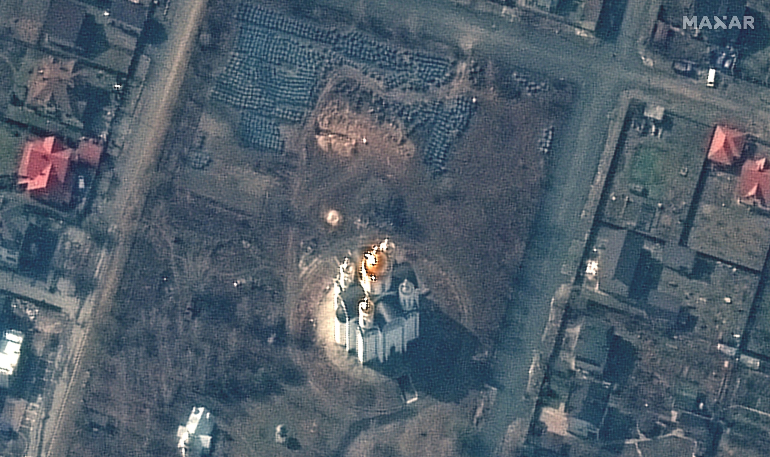 epa09869750 A handout satellite image made available by Maxar Technologies shows a probable grave site (C, top) near the Church of Saint Andrew and Pyervozvannoho All Saints in Bucha, Ukraine, 31 March 2022 (issued 04 April 2022).  EPA/MAXAR TECHNOLOGIES HANDOUT -- MANDATORY CREDIT: SATELLITE IMAGE 2022 MAXAR TECHNOLOGIES -- THE WATERMARK MAY NOT BE REMOVED/CROPPED -- HANDOUT EDITORIAL USE ONLY/NO SALES