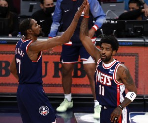 epa09872844 Brooklyn Nets forward Kevin Durant (C) and teammate Brooklyn Nets guard Kyrie Irving (R) high-five each other the first half of the NBA basketball game between the Houston Rockets and the Brooklyn Nets at the Barclays Center in Brooklyn, New York, USA, 05 April 2022.  EPA/JASON SZENES SHUTTERSTOCK OUT