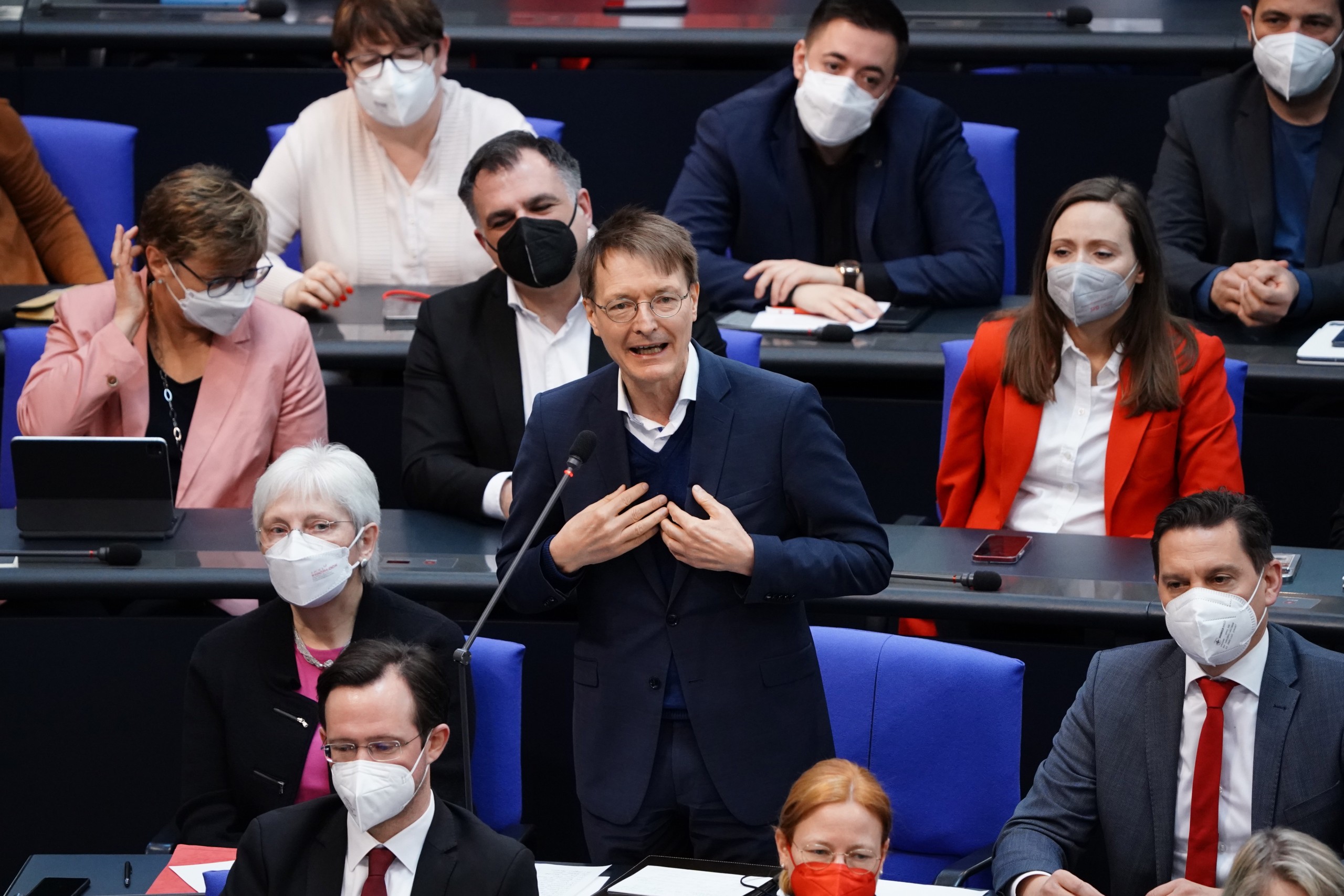 epa09875064 German Health Minister Karl Lauterbach answers from his Member of Parliament's seat  during a debate of the German Bundestag in Berlin, Germany, 07 April 2022. Among other topics, the members of the German parliament Bundestag are about to vote on the subject of a mandatory vaccination against the Covid-19 disease caused by the coronavirus. An additional item on the agenda will discuss a master plan for help for Ukrainian women and children.  EPA/CLEMENS BILAN