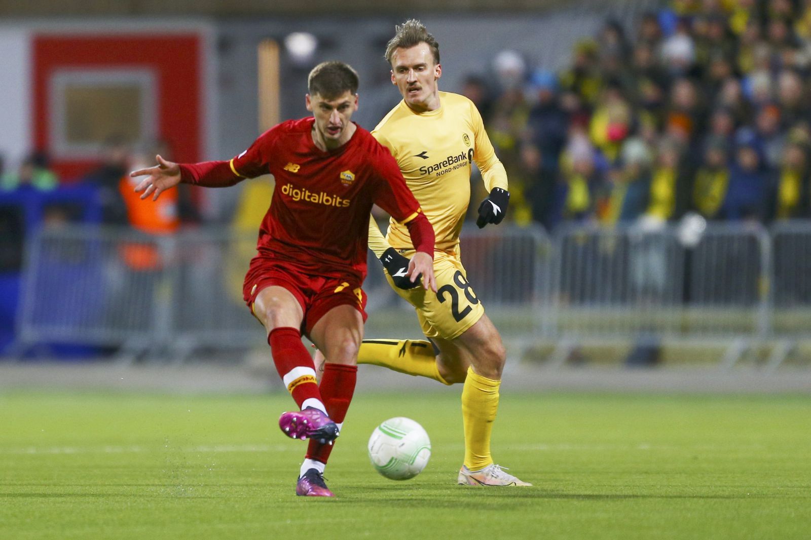 epa09876815 Roma's Marash Kumbulla (L) and Bodo Glimt's Runar Espejord in action during the UEFA Conference League quarter final, first leg soccer match between Bodo Glimt and AS Roma at Aspmyra stadium in Bodo, norway, 07 April 2022.  EPA/Mats Torbergsen  NORWAY OUT