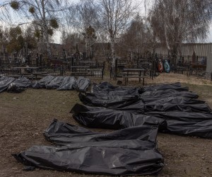 epa09876886 Bodies of killed people, which were brought to the cemetery, lay on the ground in body bags, in Bucha, northwest of Kyiv, Ukraine, 07 April 2022. Hundreds of tortured and killed civilians have been found in Bucha and other parts of the Kyiv region after the Russian army retreated from those areas. The growing evidence shows that the Russian forces are believed to be behind the atrocities when they were controlling the areas. Russian troops entered Ukraine on 24 February resulting in fighting and destruction in the country and triggering a series of severe economic sanctions on Russia by Western countries.  EPA/ROMAN PILIPEY