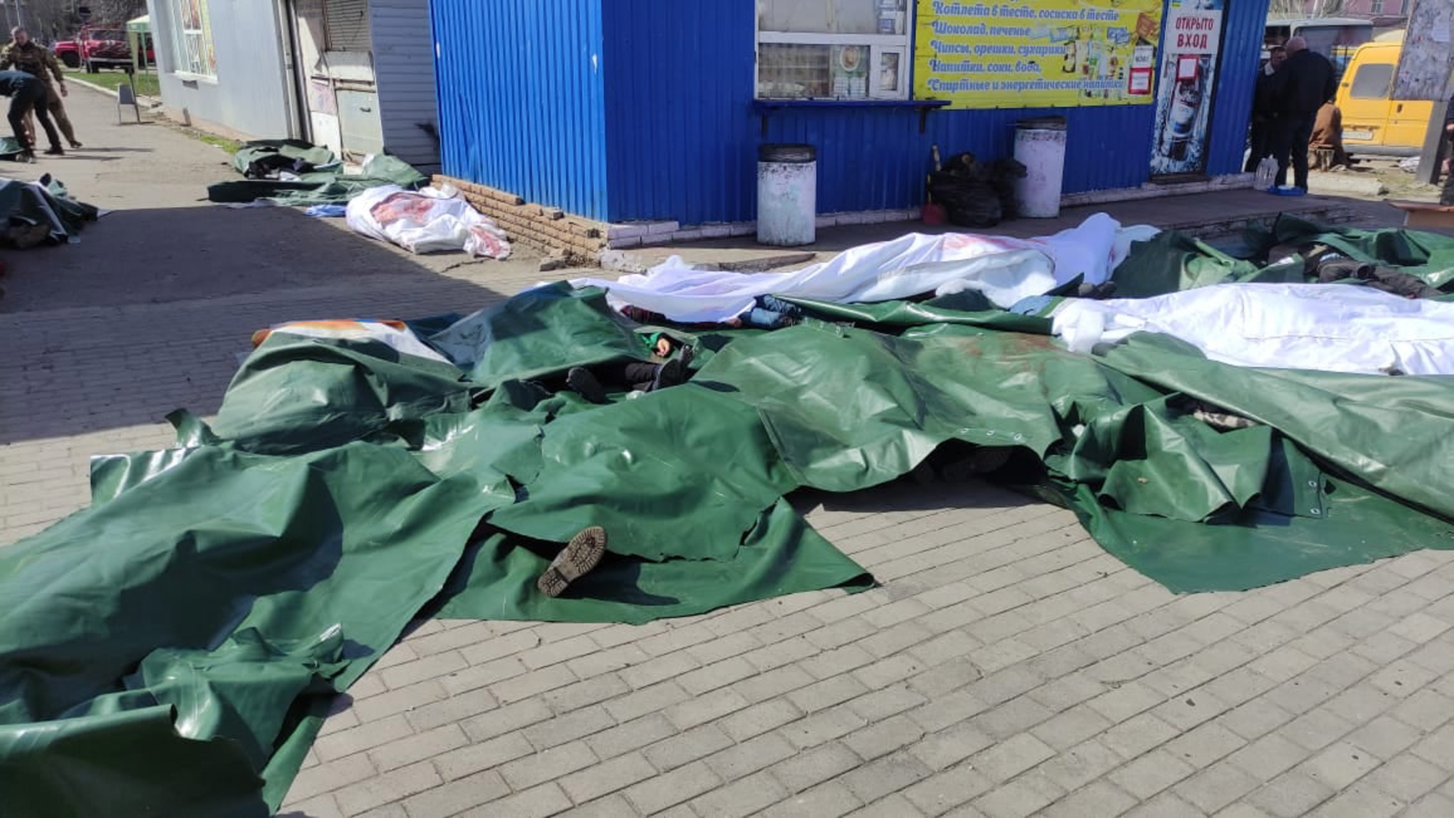 epa09878020 A handout picture made available by the Donetsk Regional State Administration shows covered bodies of casualties after a missile strike hit the railway station in Kramatorsk, Donbass region, eastern Ukraine, 08 April 2022. According to Ukrainian authorities more than 30 people have been killed and over 100 others wounded in the rocket attack. Thousands of people were at the station during the missile strike, as residents of Donetsk region are being evacuated to safer regions of Ukraine, according to a statement from the Donetsk Regional State Administration.  EPA/DONETSK REGIONAL STATE ADMINISTRATION HANDOUT BEST QUALITY AVAILABLE -- MANDATORY CREDIT: DONETSK REGIONAL STATE ADMINISTRATION -- HANDOUT EDITORIAL USE ONLY/NO SALES