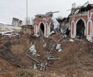 epa09881294 An impact crater from shelling in front of a shelled library in the city of Chernihiv, which was blocked by Russian troops for a long time, Ukraine, 09 April 2022. Some cities and villages had recently been recaptured by the Ukrainian army from Russian forces and now people try to restore normal life there. Russian troops entered Ukraine on 24 February resulting in fighting and destruction in the country and triggering a series of severe economic sanctions on Russia by Western countries.  EPA/SERGEY DOLZHENKO