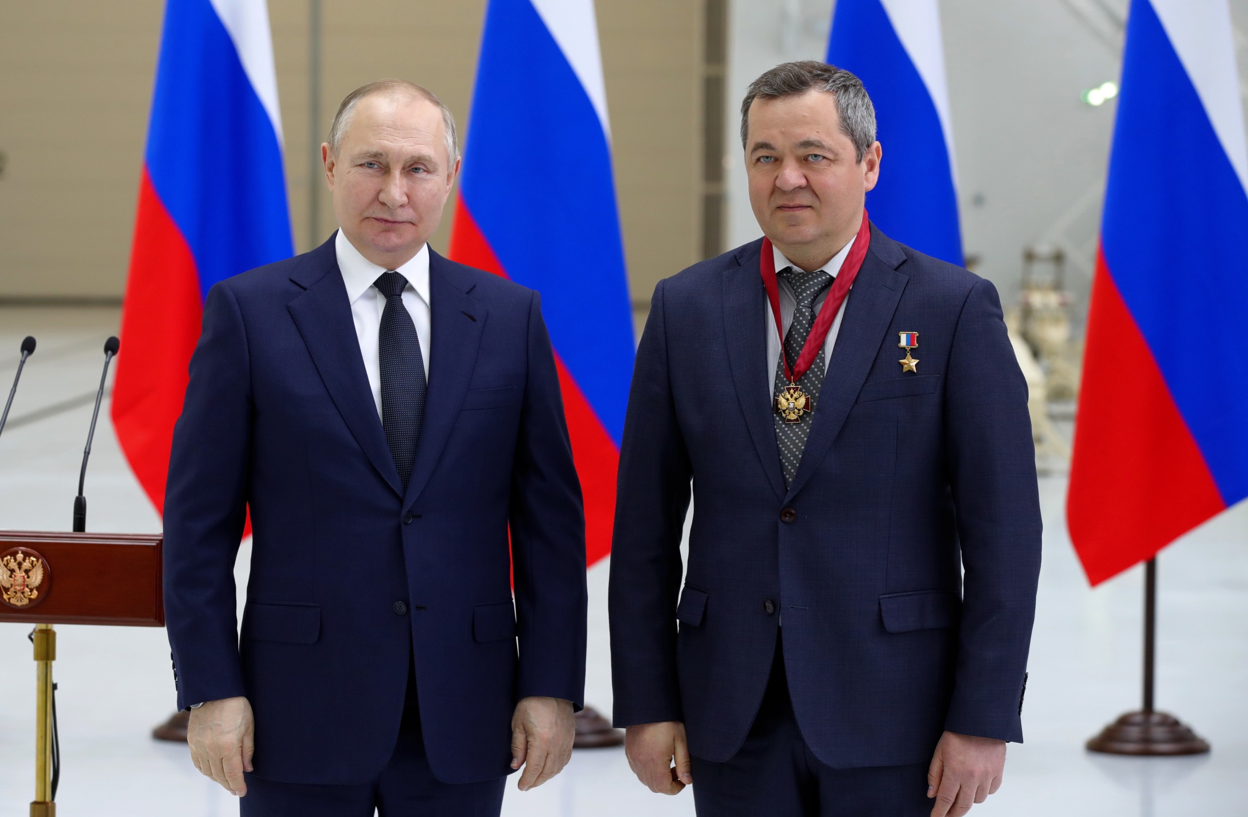 epa09885851 Russian President Vladimir Putin (L) and Roscosmos cosmonaut Oleg Skripochka (R) awarded with the Order of Merit for the Fatherland (3d class) pose for a picture during a state award ceremony at the Vostochny cosmodrome outside the city of Tsiolkovsky, some 180 km north of Blagoveschensk, in the far eastern Amur region, Russia, 12 April 2022.  EPA/MIKHAIL KLIMENTYEV / KREMLIN POOL / SPUTNIK MANDATORY CREDIT