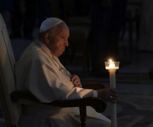 epa09893645 Pope Francis holds a candle as he attends the Easter Vigil Mass in Saint Peter's Basilica at the Vatican, 16 April 2022.  EPA/CLAUDIO PERI
