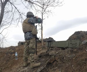 epa09896209 A Ukrainian serviceman takes a position in a zone between Luhansk and Donetsk areas, Ukraine, 18 April 2022, amid increasing Russian troops activity. Russian troops entered Ukraine on 24 February resulting in fighting and destruction in the country and triggering a series of severe economic sanctions on Russia by Western countries.  EPA/STR