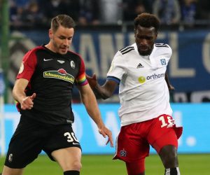 epa09897652 Hamburg’s Bakery Jatta (R) in action against Freiburg's Christian Guenter (L) during the German DFB Cup semi final soccer match between Hamburger SV and SC Freiburg in Hamburg, Germany, 19 April 2022.  EPA/FOCKE STRANGMANN CONDITIONS - ATTENTION: The DFB regulations prohibit any use of photographs as image sequences and/or quasi-video.