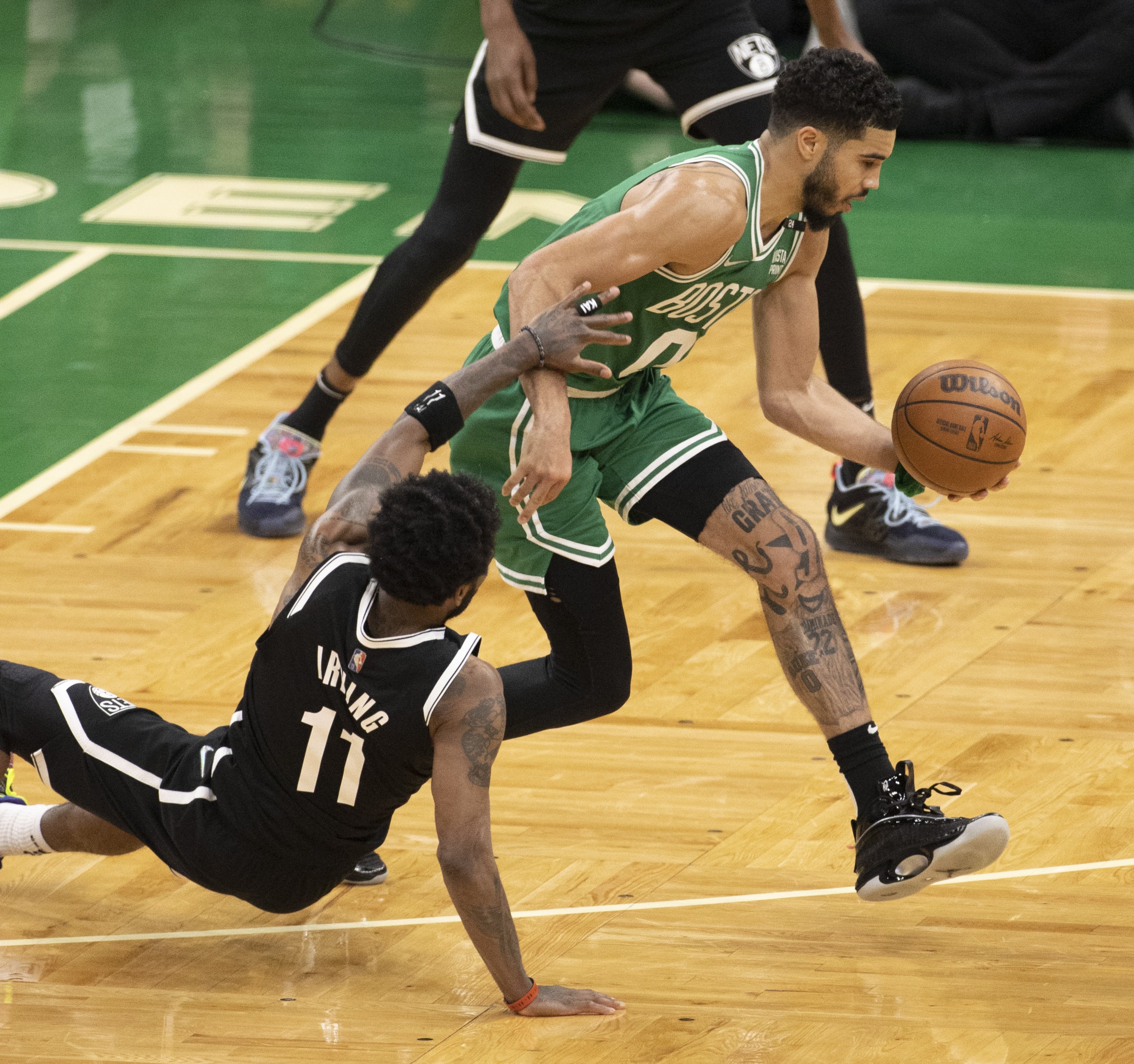 epa09899958 Boston Celtics forward Jayson Tatum (R) keeps the ball away from Brooklyn Nets guard Kyrie Irving (L) during the fourth quarter of the Eastern Conference first round playoff game two between the Brooklyn Nets and Boston Celtics at the TD Garden in Boston, Massachusetts, USA, 20 April 2022.  EPA/CJ GUNTHER SHUTTERSTOCK OUT