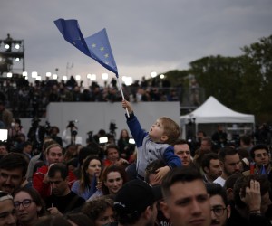 epa09907231 Supporters of French President and candidate for re-election Emmanuel Macron (not pictured) celebrate at the Champs-de-Mars after Emmanuel Macron won the second round of the French presidential elections in Paris, France, 24 April 2022. Emmanuel Macron defeated Marine Le Pen in the final round of France's presidential election, with exit polls indicating that Macron is leading with approximately 58 percent of the vote.  EPA/YOAN VALAT