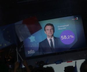 epa09907316 Supporters of French President and candidate for re-election Emmanuel Macron (not pictured) celebrate at the Champs-de-Mars after Emmanuel Macron won the second round of the French presidential elections in Paris, France, 24 April 2022. Emmanuel Macron defeated Marine Le Pen in the final round of France's presidential election, with exit polls indicating that Macron is leading with approximately 58 per cent of the vote.  EPA/CHRISTOPHE PETIT TESSON