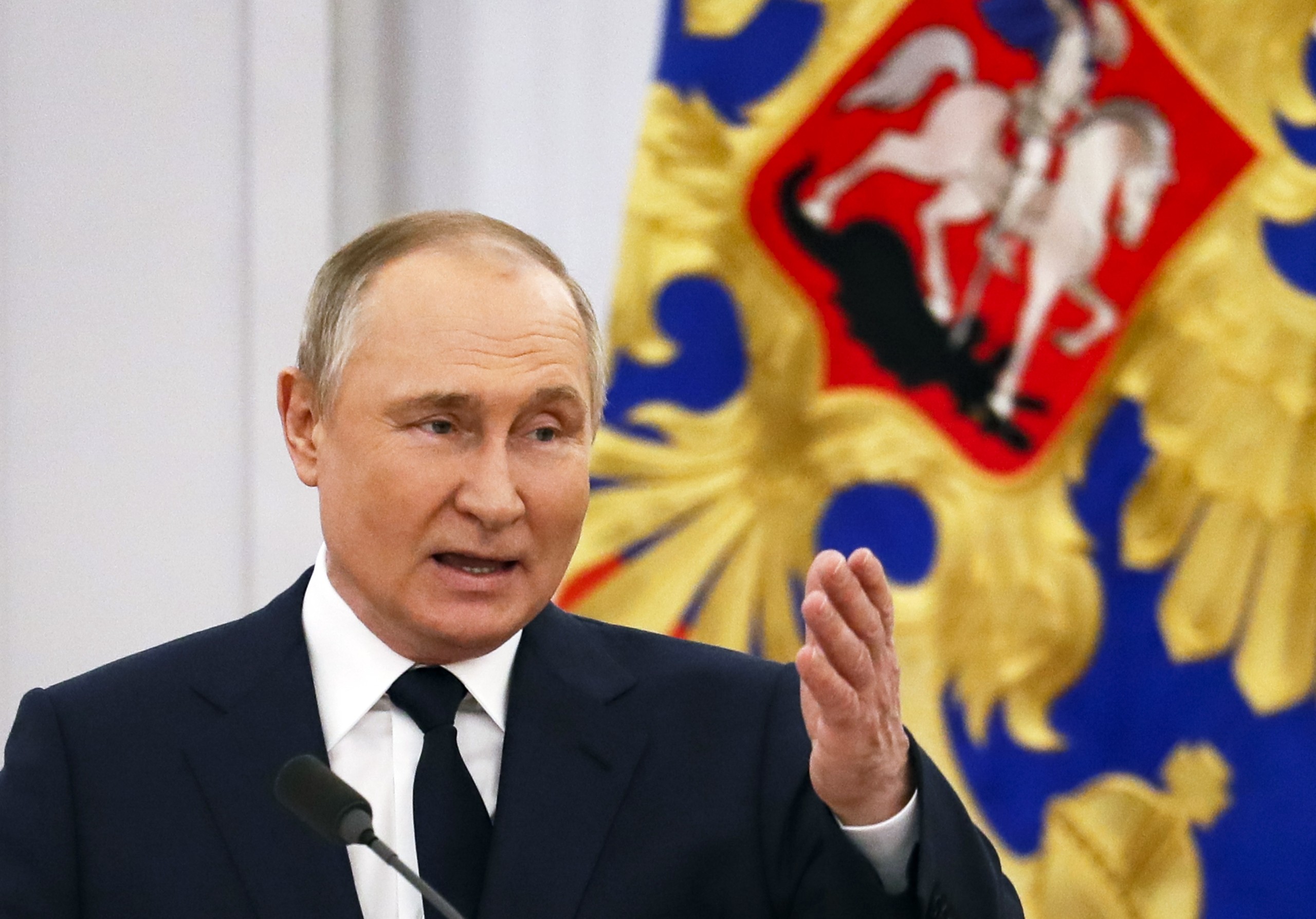 epa09910064 Russian President Vladimir Putin meets with Russian Olympic and Paralympic athletes during a state awards ceremony for Russian medal winners of the Beijing 2022 Olympic Winter Games at the Kremlin in Moscow, Russia, 26 April 2022.  EPA/YURI KOCHETKOV