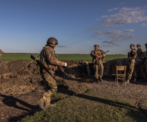 epa09913335 Members of the Ukrainian army gather at a checkpoint near the frontline at Huliaipole district, in the Zaporizhzhia region, Ukraine, 27 April 2022. Russian troops entered Ukraine on 24 February resulting in fighting and destruction in the country and triggering a series of severe economic sanctions on Russia by Western countries.  EPA/ROMAN PILIPEY