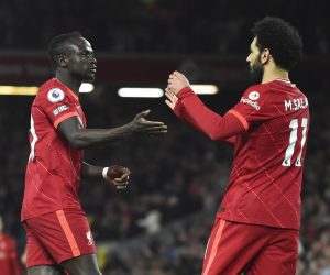 epa09897930 Sadio Mane (L) of Liverpool celebrates with teammate Mohamed Salah (R) after scoring the 3-0 goal during the English Premier League soccer match between Liverpool and Manchester United in Liverpool, Britain, 19 April 2022.  EPA/PETER POWELL EDITORIAL USE ONLY. No use with unauthorized audio, video, data, fixture lists, club/league logos or 'live' services. Online in-match use limited to 120 images, no video emulation. No use in betting, games or single club/league/player publications