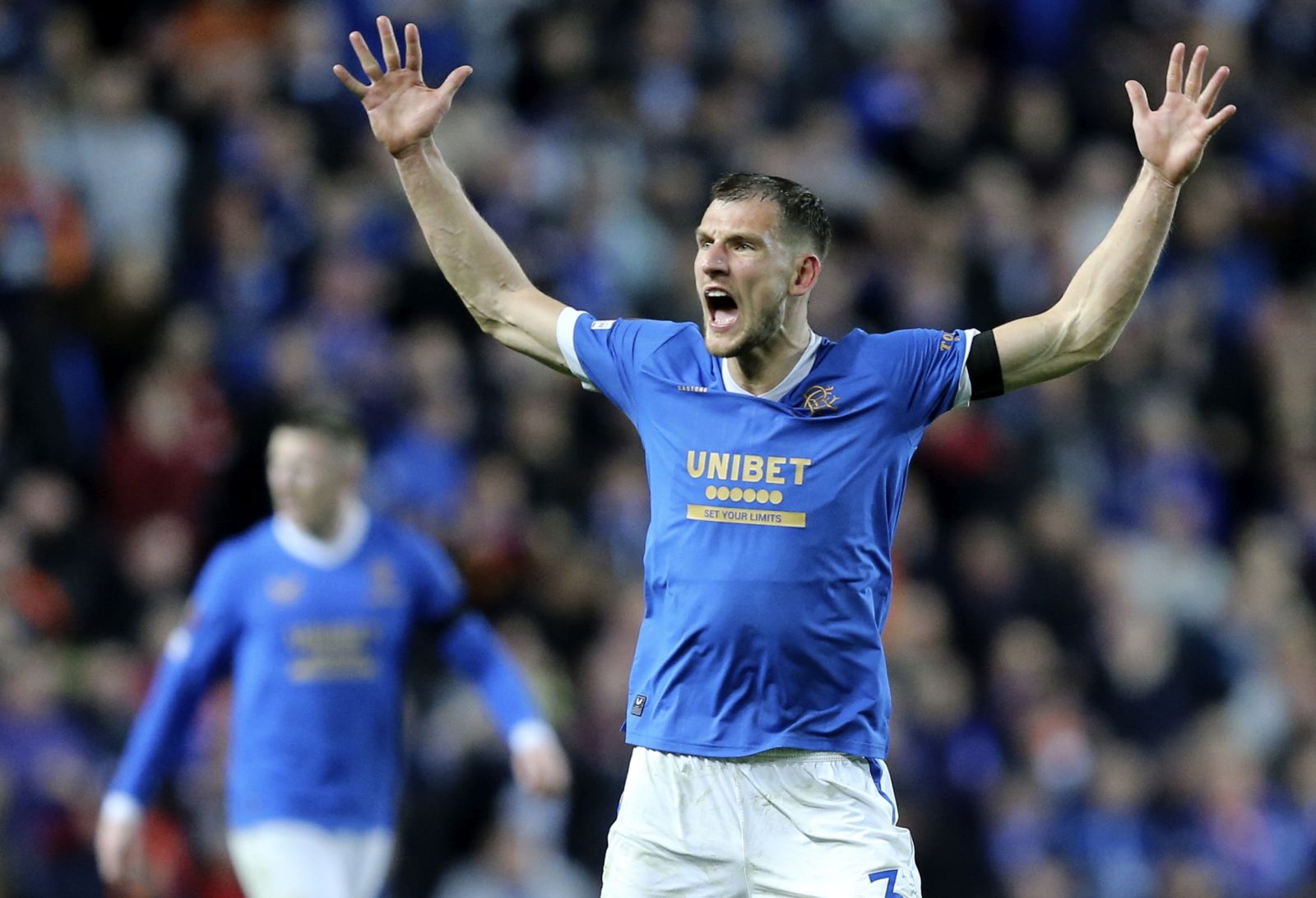 epa09929479 Borna Barisic of Rangers celebrates after winning the UEFA Europa League semi final, second leg soccer match between Rangers FC and RB Leipzig in Glasgow, Britain, 05 May 2022.  EPA/ROBERT PERRY