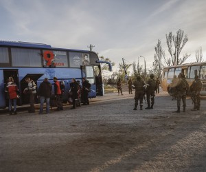epa09930809 Russian servicemen control the boarding of a bus by the civilian people who were evacuated from Azovstal in Mariupol, Ukraine, 06 May 2022.  According to the Interdepartmental Coordinating Headquarters of the Russian Federation for Humanitarian Response, 50 civilians, including 11 children, were evacuated from a bomb shelter at the Azovstal plant. On 24 February, Russian troops had entered Ukrainian territory in what the Russian president declared a 'special military operation', resulting in fighting and destruction in the country. According to data released by the United Nations High Commission for the Refugees (UNHCR) on 05 May, over 5.7 million refugees have fled Ukraine seeking safety, protection and assistance in neighboring countries.  EPA/ALESSANDRO GUERRA
