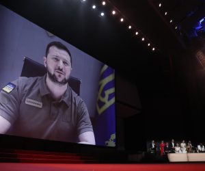 epa09953464 Ukraine's President Volodymyr Zelensky appears via remote on a screen during the Opening Ceremony of the 75th annual Cannes Film Festival, in Cannes, France, 17 May 2022. The festival runs from 17 to 28 May.  EPA/GUILLAUME HORCAJUELO